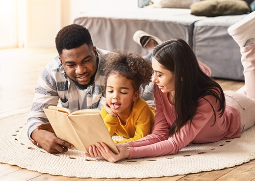 A family reading a book together